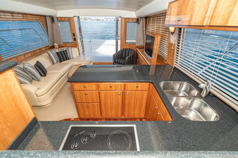 Slide: The Image of Luxurious interior of 2006 Navigator 5100 yacht with modern kitchen and seating area. - 22