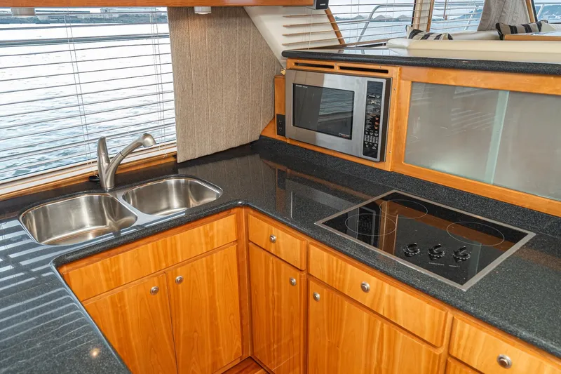 Slide: The Image of Luxurious 2006 Navigator 5100 yacht kitchen with modern appliances and sleek countertops. - 25