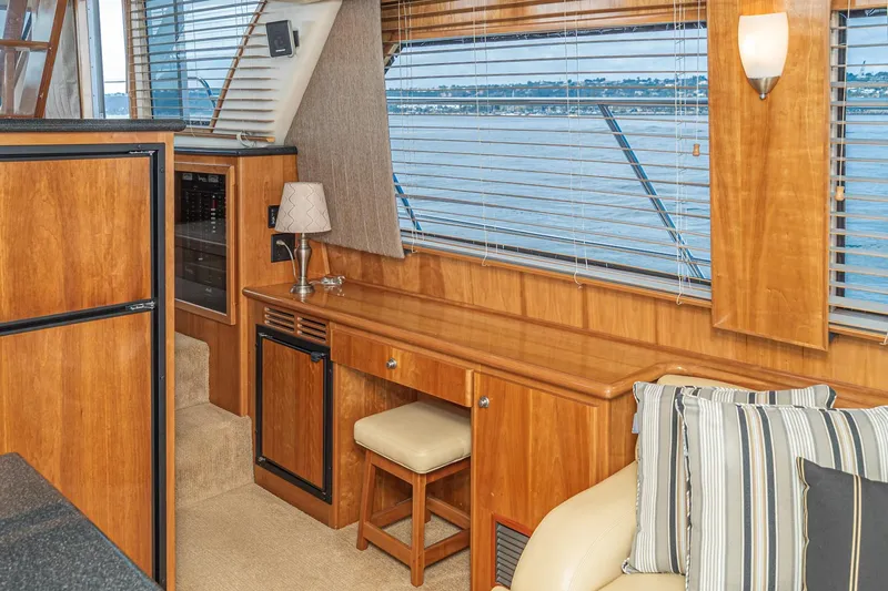 Slide: The Image of Luxurious 2006 Navigator 5100 yacht interior with wooden cabinetry and scenic window view. - 28