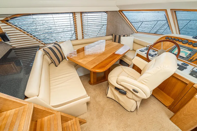 Slide: The Image of Luxurious interior of 2006 Navigator 5100 yacht with plush seating and elegant helm. - 30