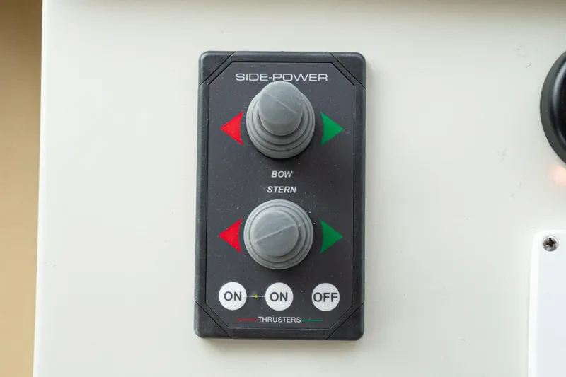 Slide: The Image of Control panel for Navigator 5100 boat thrusters, featuring bow and stern toggles. - 33