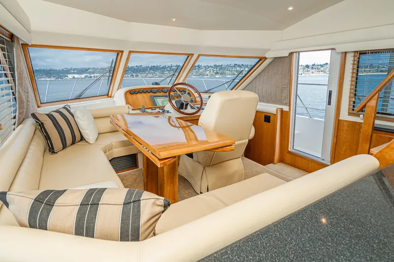 Slide: The Image of Luxurious 2006 Navigator 5100 yacht interior with plush seating and panoramic windows. - 34