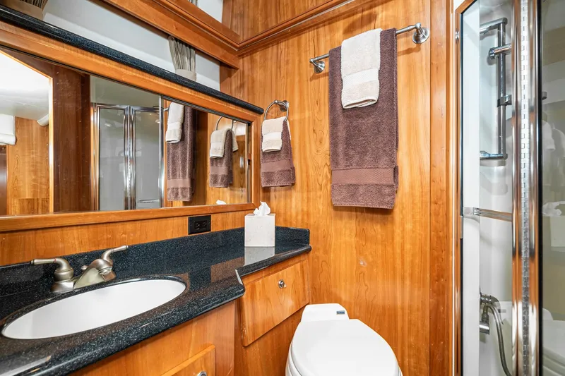 Slide: The Image of Luxurious 2006 Navigator 5100 yacht bathroom with wood accents and modern fixtures. - 39