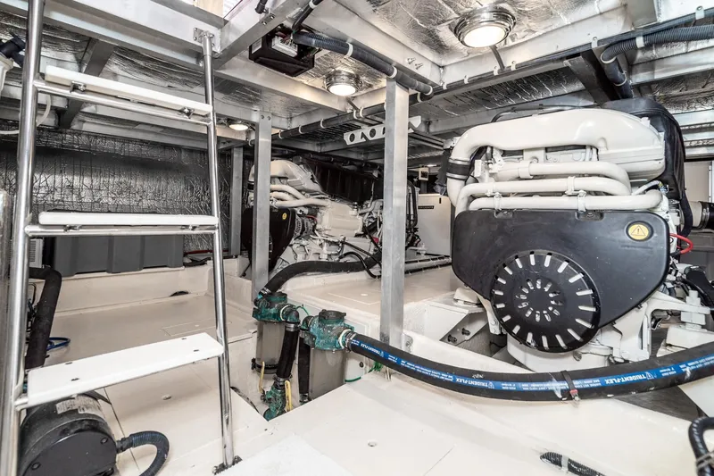 Slide: The Image of Engine room of 2006 Navigator 5100 yacht with dual engines and metallic interior. - 45