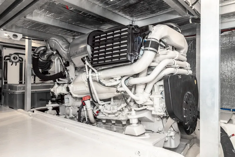 Slide: The Image of Engine room of 2006 Navigator 5100 yacht, showcasing a well-maintained marine engine. - 47