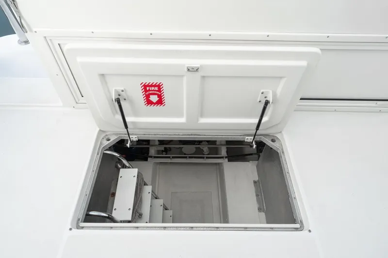 Slide: The Image of Open hatch on 2006 Navigator 5100 yacht with fire extinguisher sign visible. - 49