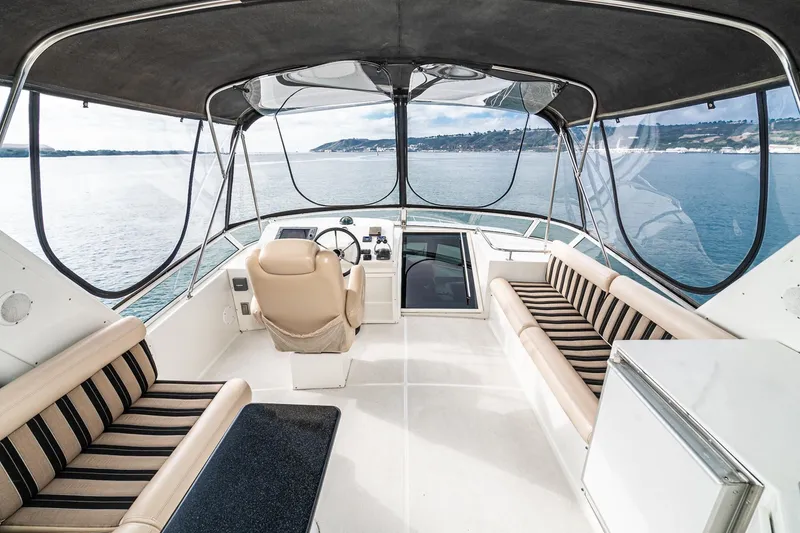 Slide: The Image of Luxurious 2006 Navigator 5100 yacht interior with panoramic ocean view and elegant seating. - 8