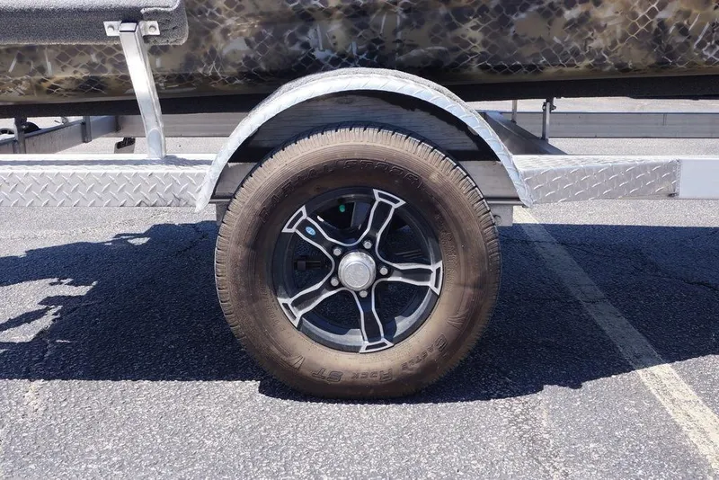 Slide: The Image of Trailer wheel on Excel 1751 F4, 2021 model, parked on asphalt. - 11