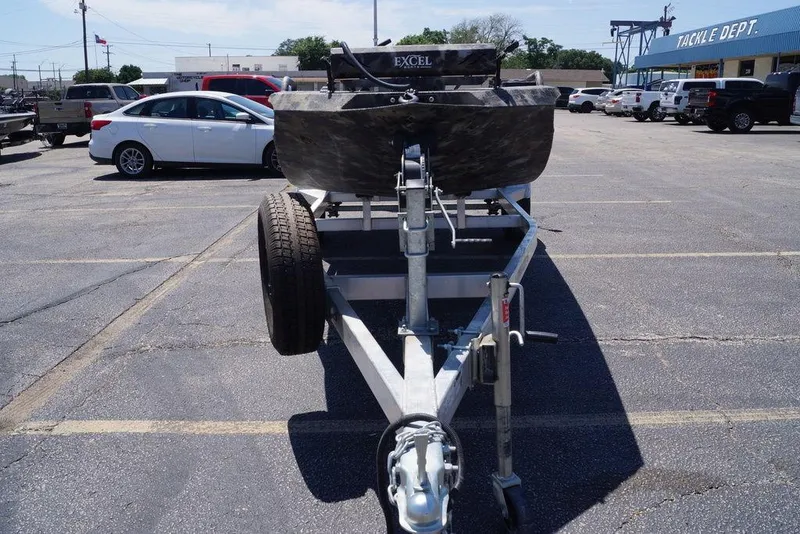 Slide: The Image of Front view of a 2021 Excel 1751 F4 boat on a trailer in a parking lot. - 2