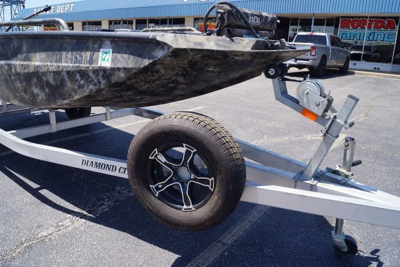 Slide: The Image of 2021 Excel 1751 F4 boat on Diamond City trailer, parked outside Honda Marine dealership. - 3