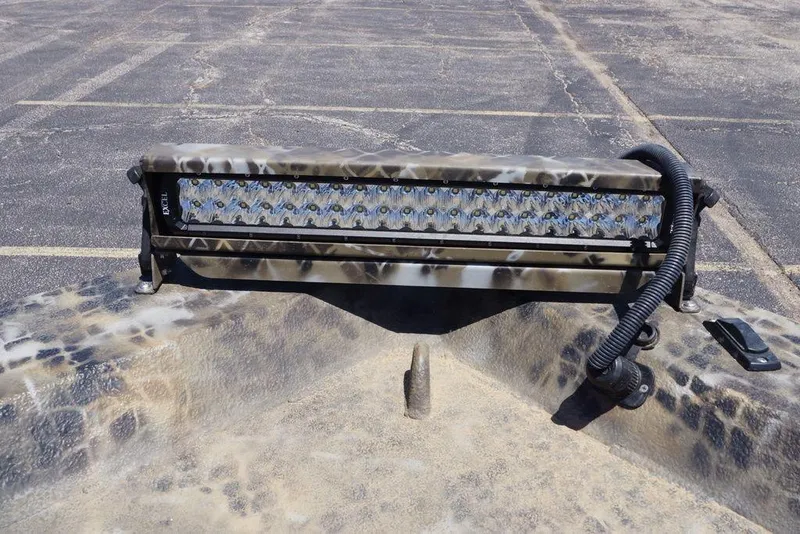 Slide: The Image of Camouflage-patterned LED light bar on Excel 1751 F4 boat, 2021 model, in a parking lot. - 9