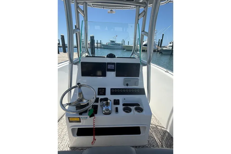 Slide: The Image of 2020 Cape Horn 22 OS boat console with steering wheel and navigation equipment at marina. - 5