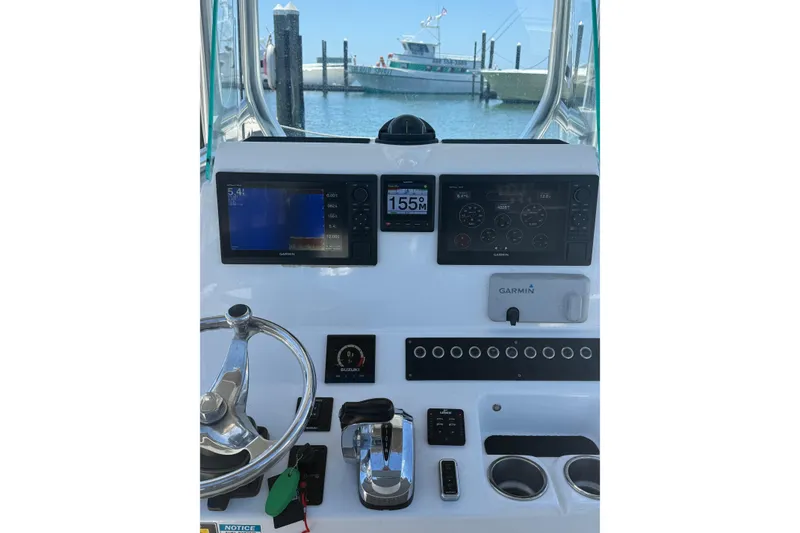 Slide: The Image of 2020 Cape Horn 22 OS boat dashboard with Garmin navigation system and controls. - 6
