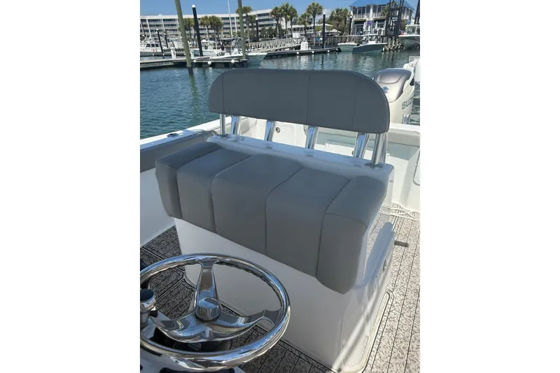 Slide: The Image of 2020 Cape Horn 22 OS boat helm seat with steering wheel, docked at marina. - 7