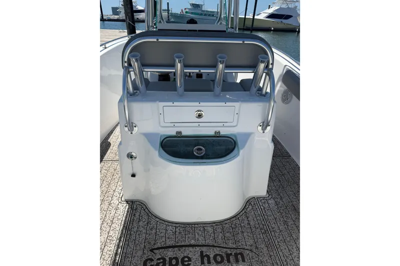 Slide: The Image of 2020 Cape Horn 22 OS boat interior with rod holders and storage compartment. - 9