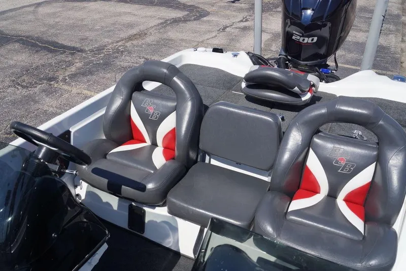 Slide: The Image of 2011 Bass Cat Pantera II boat interior with leather seats and steering wheel. - 14