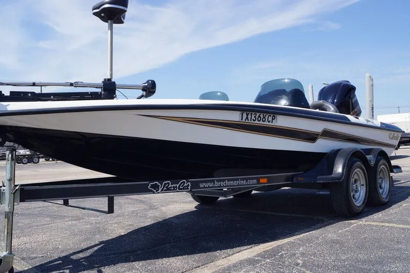 Slide: The Image of 2011 Bass Cat Pantera II boat on trailer in parking lot. - 19