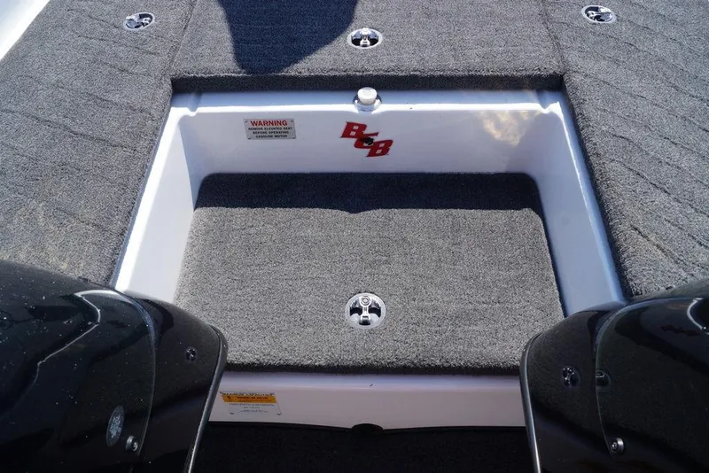 Slide: The Image of 2011 Bass Cat Pantera II boat interior with carpeted storage compartment. - 20