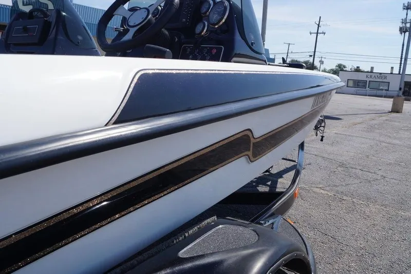 Slide: The Image of 2011 Bass Cat Pantera II boat, close-up of sleek design and dashboard. - 21
