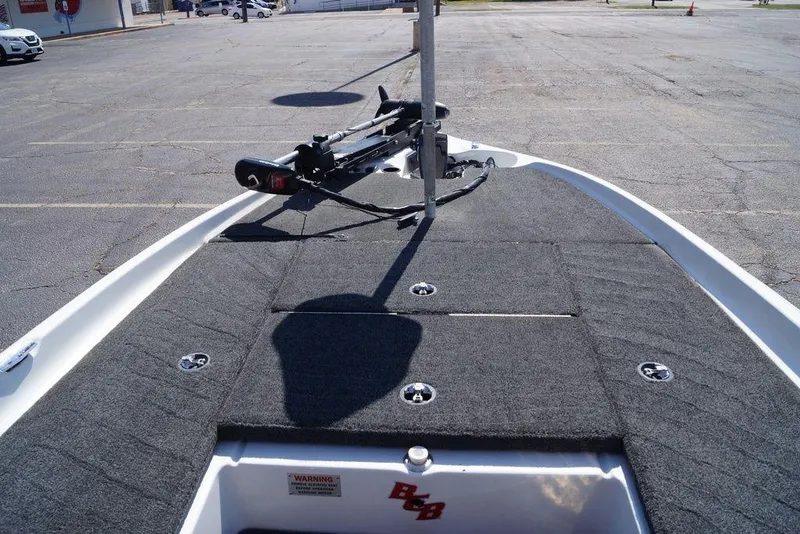 Slide: The Image of 2011 Bass Cat Pantera II boat deck with trolling motor in parking lot. - 23