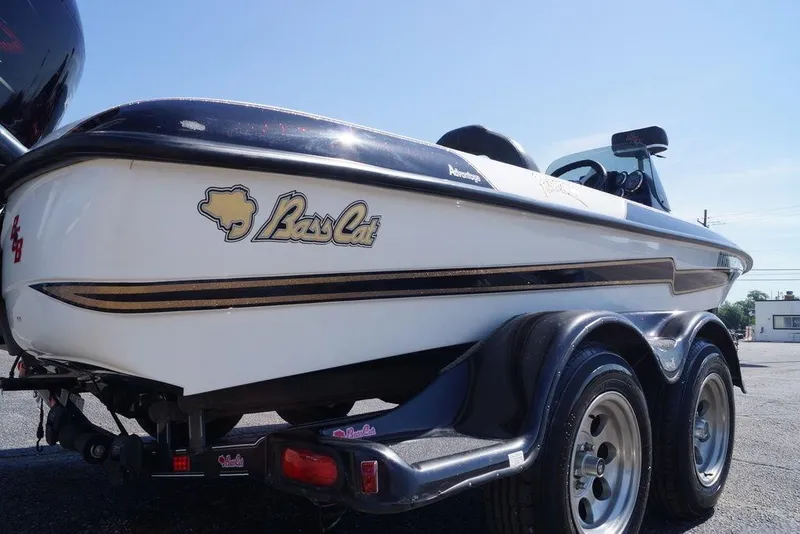 Slide: The Image of 2011 Bass Cat Pantera II boat on trailer, showcasing sleek design and branding. - 5