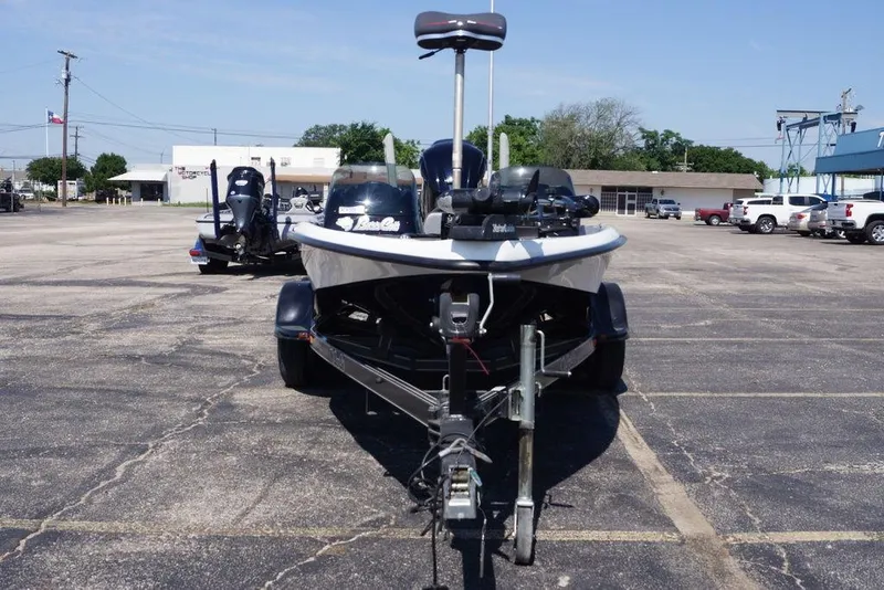 Slide: The Image of 2011 Bass Cat Pantera II boat on trailer in parking lot, sunny day. - 6