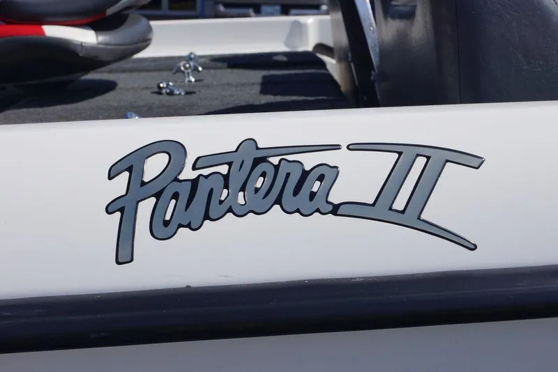 Slide: The Image of 2011 Bass Cat Pantera II boat logo on white surface. - 7