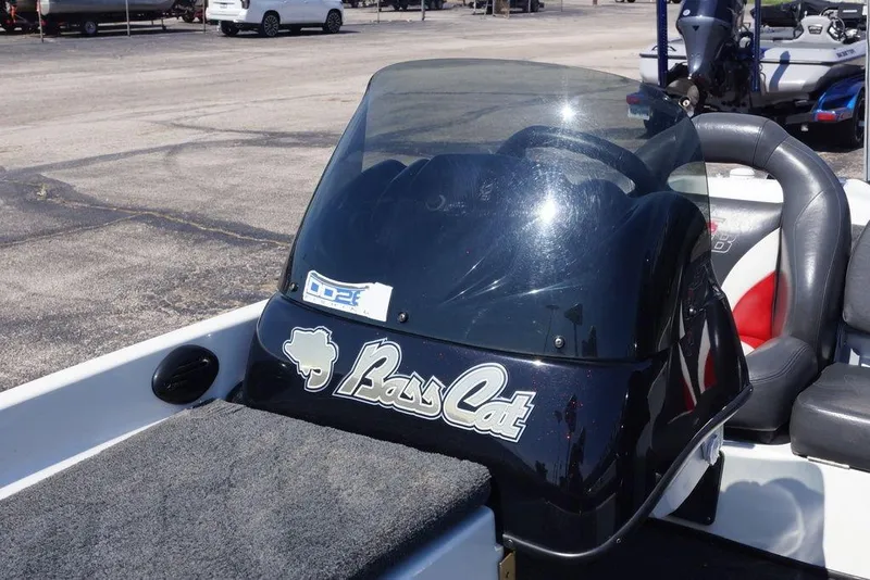 Slide: The Image of 2011 Bass Cat Pantera II boat dashboard with logo and windshield. - 8