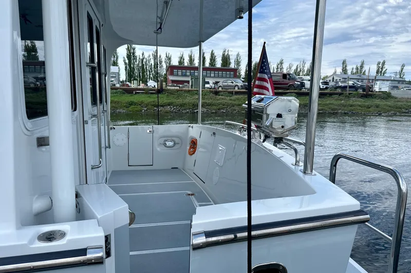 Slide: The Image of 2024 Helmsman 38E - Cockpit Port & Starboard Boarding Doors - 16