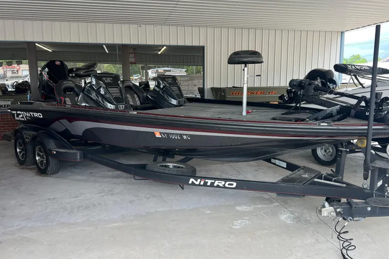 The Image of 2024 Nitro Z21 XL Pro bass boat displayed in showroom, featuring sleek design and advanced features. - 0