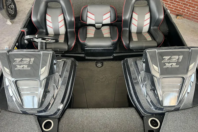 Slide: The Image of 2024 Nitro Z21 XL Pro boat interior with sleek seating and dual consoles. - 3