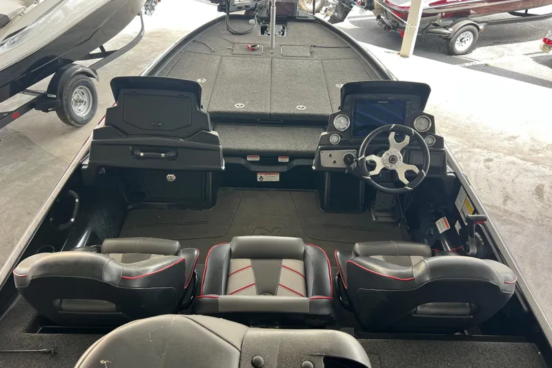 Slide: The Image of 2024 Nitro Z21 XL Pro boat interior with dual seats and advanced dashboard controls. - 4
