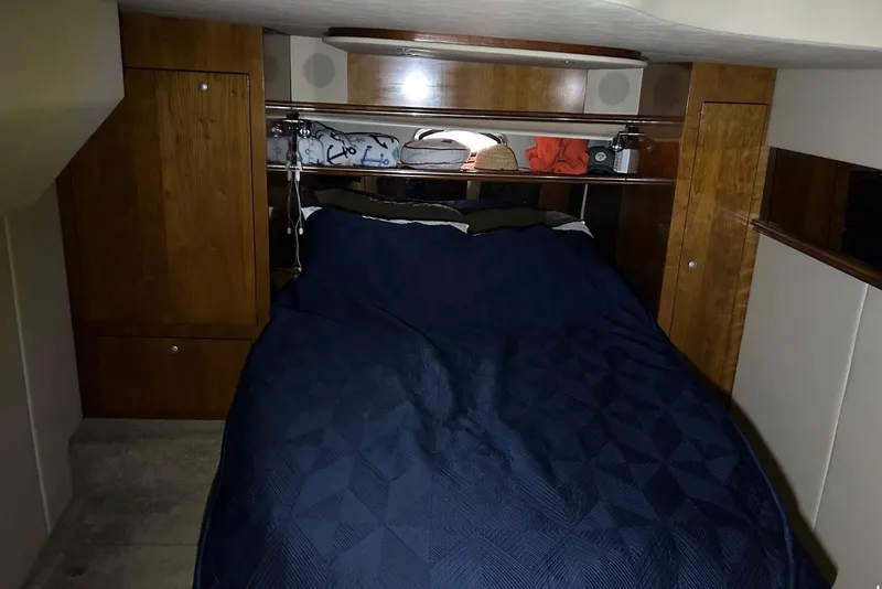 Slide: The Image of Luxurious cabin interior of 2006 Cruisers Yachts 460 Express with cozy bedding. - 10