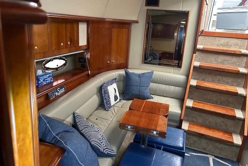 Slide: The Image of Luxurious 2006 Cruisers Yachts 460 Express interior with plush seating and elegant wood finishes. - 3