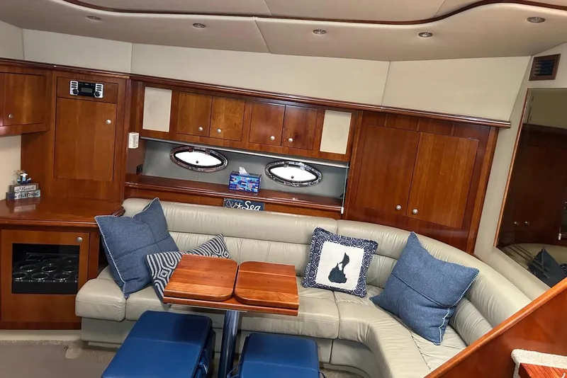 Slide: The Image of Luxurious 2006 Cruisers Yachts 460 Express interior with plush seating and elegant wood finishes. - 4