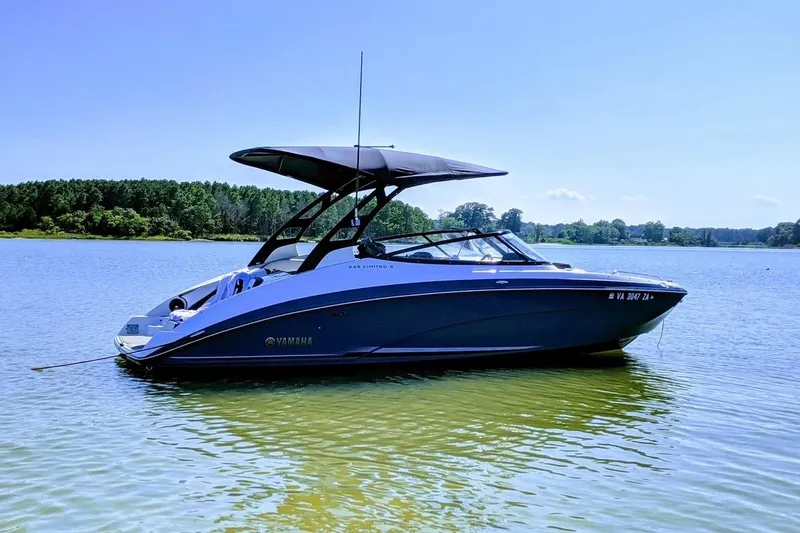 Slide: The Image of 2018 Yamaha Boats 242 Limited S E-Series on a serene lake. - 1