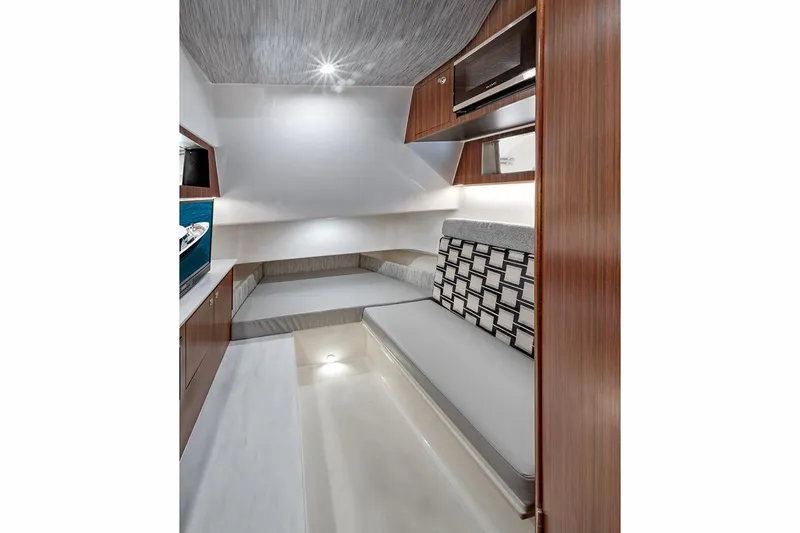 Slide: The Image of Manufacturer Provided Image: Interior cabin of 2025 Pursuit S 358 Sport boat, featuring modern design and comfortable seating. - 13