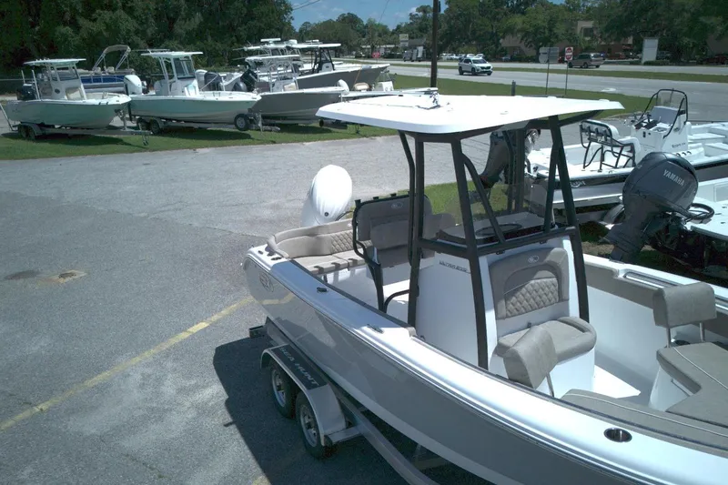Slide: The Image of 2026 Sea Hunt Ultra 219 boat on trailer in outdoor dealership lot. - 3
