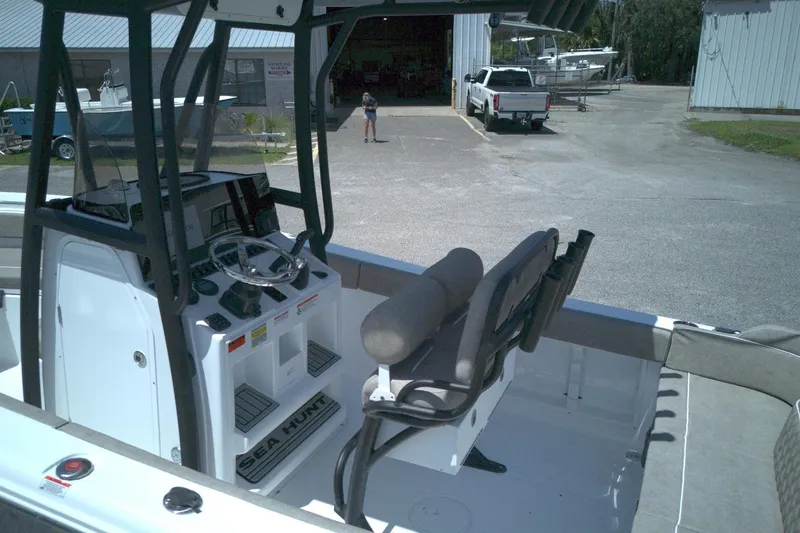 Slide: The Image of Interior view of a 2026 Sea Hunt Ultra 219 boat, showcasing the helm and seating area. - 5