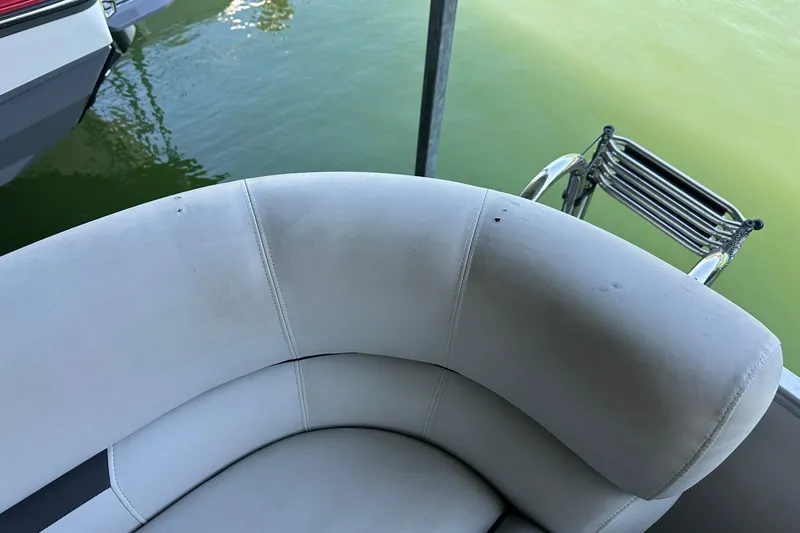 Slide: The Image of 2022 Godfrey Sweetwater 2286 SB boat seat with water view and ladder. - 4