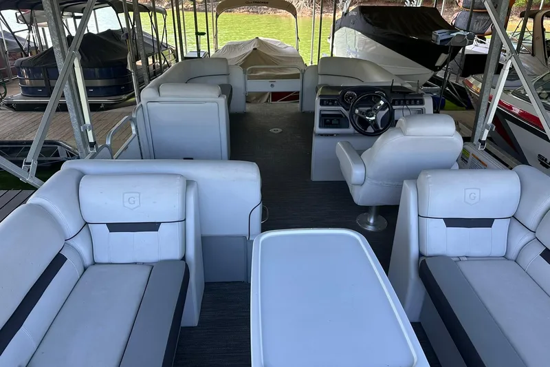 Slide: The Image of Interior of a 2022 Godfrey Sweetwater 2286 SB pontoon boat with seating and helm. - 6