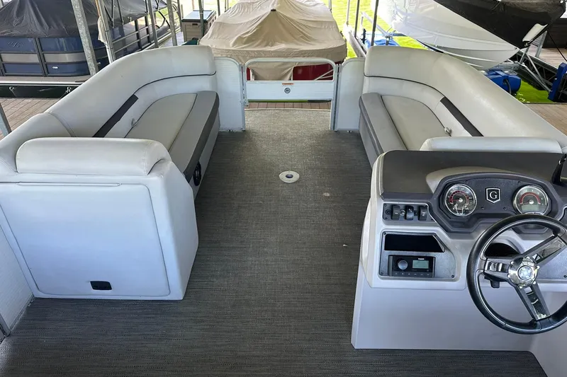 Slide: The Image of Interior of a 2022 Godfrey Sweetwater 2286 SB pontoon boat with seating and helm. - 8