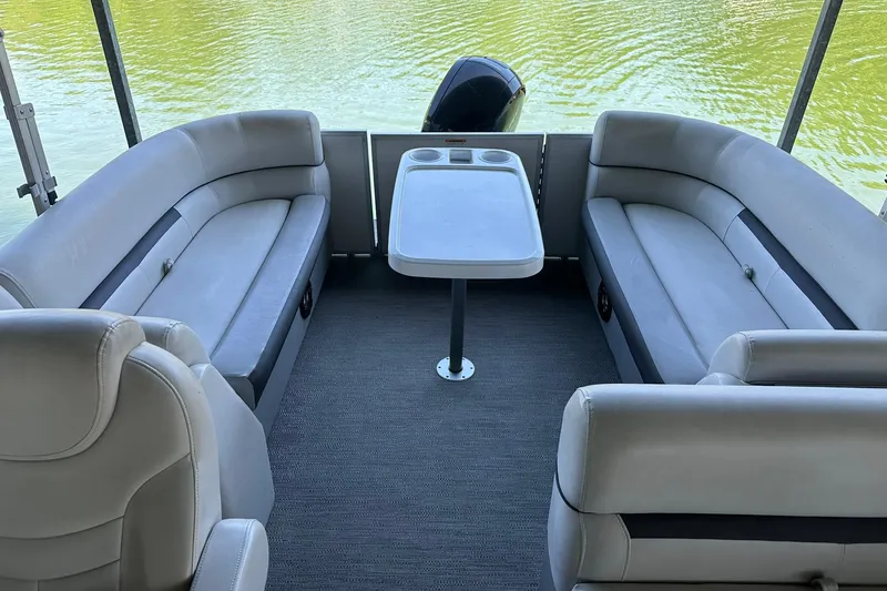 Slide: The Image of Interior of 2022 Godfrey Sweetwater 2286 SB pontoon boat with seating and table. - 9