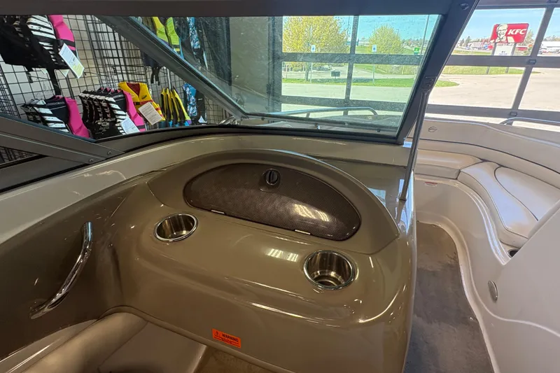 Slide: The Image of Interior of a 2008 Crownline 210 LS boat with cup holders and seating. - 12