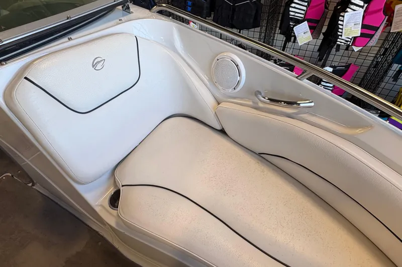 Slide: The Image of 2008 Crownline 210 LS boat interior with white seating and speaker detail. - 16