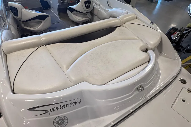 Slide: The Image of 2008 Crownline 210 LS boat interior with white seating and "Spontaneous" text. - 6