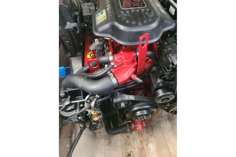 Slide: The Image of 2009 Bryant 268 engine close-up, showcasing detailed components and vibrant red accents. - 16