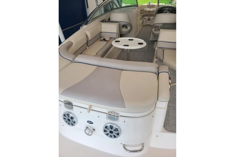 Slide: The Image of Interior of a 2009 Bryant 268 boat with beige seating and cup holders. - 4