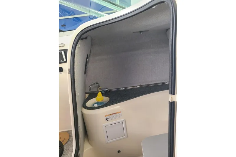 Slide: The Image of 2009 Bryant 268 boat interior with compact sink and storage area. - 5