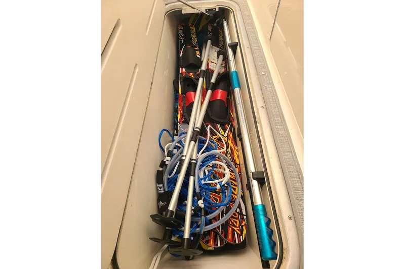 Slide: The Image of Storage compartment in a 2009 Bryant 268 boat with water sports equipment. - 6